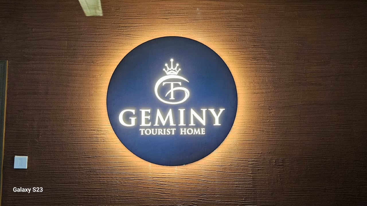 Illuminated circular wall emblem of Geminy Tourist Home